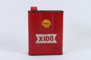 A CAN OF SHELL X-100 OIL.