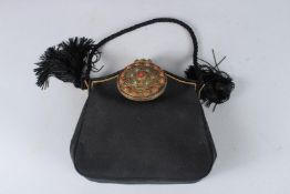 A BLACK LINEN BAG with large metal clasp. Signed AUSEIZE. 8ins.