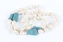 A PEARL AND TURQUOISE NECKLACE. 100cms long.