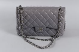 A VERY GOOD CHANEL LILAC PADDED LEATHER BAG with chrome double C, chrome and leather strap. 30cms