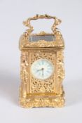 A MINI CAST BRONZE CARRIAGE CLOCK. 2.5ins.