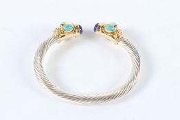 A STERLING SILVER TWISTED TORQUE BANGLE with turquoise and lapis.