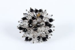 A SILVER RING set with crystals.