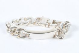 A HEAVY STERLING SILVER IDENTITY BRACELET.