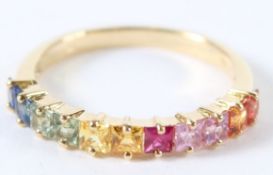 AN 18CT GOLD MULTI-SAPPHIRE HALF HOOP RING. Size N/O.