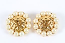 A GOOD PAIR OF CHANEL CIRCULAR GILT AND PEARL EAR CLIPS. 4cms diameter.