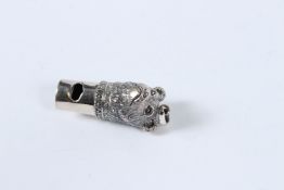 A SILVER NOVELTY BEAR WHISTLE.