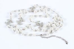 A VERY GOOD CHANEL DOUBLE ROW PEARL NECKLACE with four double C clasps.
