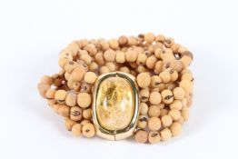 A SIGNED EIGHT ROW BEAD BRACELET.