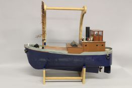 A RADIO CONTROLLED STEAM MODEL OF A VICTORIAN STEAM SHIP with steam engine and boiler, with