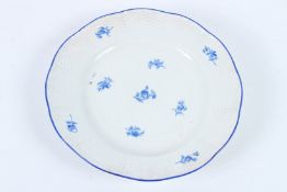 A MEISSEN BLUE AND WHITE PLATE. Cross swords mark in blue. 23cms diameter.