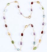 AN 18CT GOLD GEM SET NECKLACE. 50cms long.