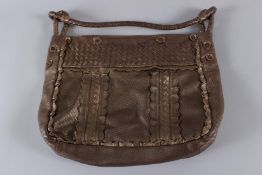 A BOTTEGA VENETA OF ITALY SOFT LEATHER BAG. 40cms long, with dust bag.