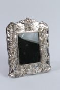 A SILVER CUPID PHOTOGRAPH FRAME.