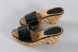 A PAIR OF CHANEL COCO MARK CORK SANDALS. Size 38.5, with dust bag.