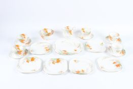 A SHELLEY PORCELAIN TEA SET, six cups, four saucers, six cake plates, milk jug, bowl and plate.