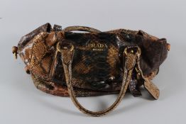 A LARGE PRADA SNAKESKIN BAG. 42cms long. Sold with Authentication Certificate.