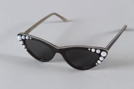 A PAIR OF FREDA BANANA SUNGLASSES AND CASE.