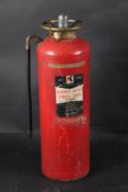 A VINTAGE KIDDE FIRE EXTINGUISHER.