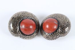 A PAIR OF SILVER EAR CLIPS.