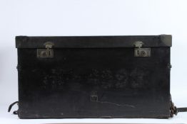 A BLACK LEATHER TRUNK with leather carrying handle. 74cms high.