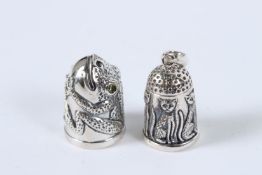 TWO SILVER NOVELTY CAT AND FROG THIMBLES.