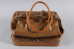 A LARGE PRADA TAN LEATHER BAG with folding top and plain leather handle. 34cms long. Sold with
