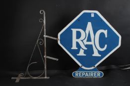 A VINTAGE RAC REPAIRER BLUE AND WHITE ENAMEL HANGING SIGN and bracket. 60cms high x 56cms wide.
