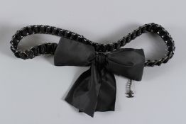 A VINTAGE CHANEL BELT with bow. 90cms long, with dust cover. Sold with Authentication Certificate.