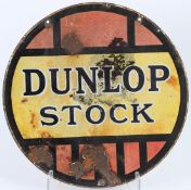 A VINTAGE DOUBLE SIDED DUNLOP STOCK CIRCULAR ENAMEL SIGN.