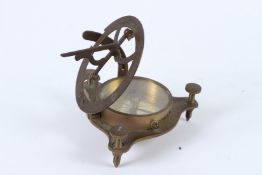 A CIRCULAR BRASS COMPASS 9cms diameter.