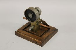 A MODEL OF AN OSCILLATING WATER MOTOR. 21cms x 21cms.