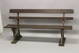 A G.W.R. CAST IRON BENCH with four wooden splats. 176cms high.