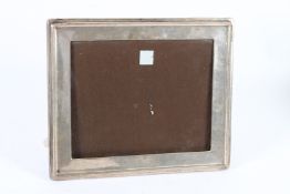 A LARGE SILVER PHOTOGRAPH FRAME. 26cms x 20cms.