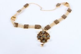 A LARGE VINTAGE NECKLACE set with pearls and coloured stones.