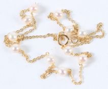 AN 18CT GOLD PEARL 17inch CHAIN NECKLACE.