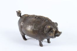 A BRONZE PIG DESK BELL. 17cms high.