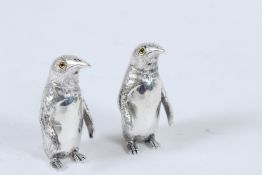 A SILVER PLATED PENGUIN SALT AND PEPPERS.