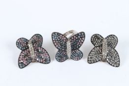 A PAIR OF SILVER BUTTERFLY EARRINGS AND A RING.