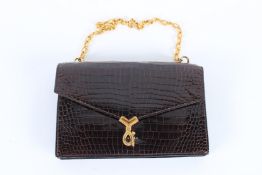 A HERMES CORDELIERE BLACK CROCODILE LEATHER BAG with gilt metal clasp. 25cms long x 16cms high, with