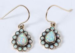 A PAIR OF 9CT GOLD PEARSHAPE OPAL EARRINGS.