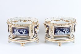 A GOOD LARGE PAIR OF CONTINENTAL PORCELAIN OVAL JARDINIERES (with bases), with gilt decoration and