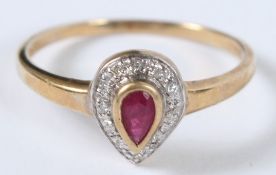 A 9CT GOLD PEARSHAPE RUBY AND DIAMOND RING.