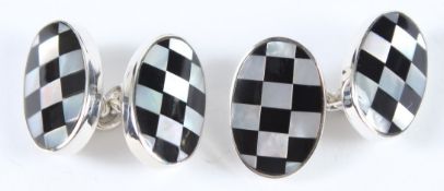A PAIR OF STERLING SILVER ONYX AND MOTHER-OF-PEARL CUFFLINKS.