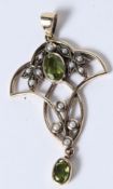 A 9CT GOLD PERIDOT AND PEARL PENDANT.