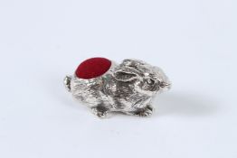 A SILVER RABBIT PIN CUSHION.