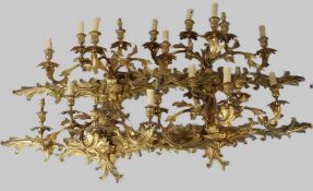 A GOOD SET OF FOUR ORMOLU FOUR LIGHT WALL APPLIQUES, with scrolling branches and foliate back