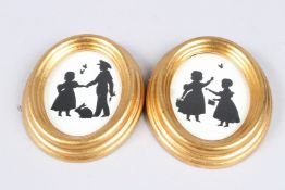 A SMALL PAIR OF SILHOUETTES.