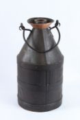 A VINTAGE BLACK METAL FIVE GALLON CAN. 52cms high.