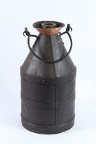A VINTAGE BLACK METAL FIVE GALLON CAN. 52cms high.